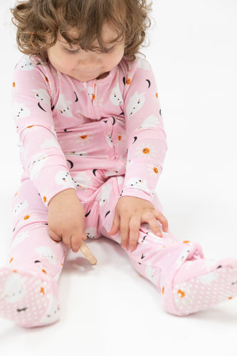 Keep your little one cozy and stylish in our Ghost Pink 2 Way Ruffle Zipper Footie Pajamas! Made with the softest material from Angel Dear, these infant pajamas feature a cute ghost design and bottom ruffle detail. Plus, the 2 way zipper makes diaper changes a breeze. A must-have for any baby's bedtime wardrobe.