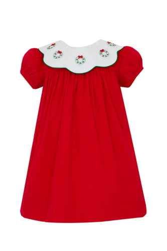 This corduroy dress from Anavini is a perfect choice for your toddler girl's Christmas events and photo opportunities. Its festive Christmas Wreath design and pretty scalloped collar make it a wonderful occasion dress.