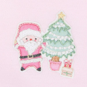 Get your little one ready for a cozy Christmas with our Sweet Little Christmas Pajamas! Featuring a festive Santa embellishment and adorable ruffle back, these pink footie pajamas from Magnolia Baby will keep your baby warm and stylish all night long. Perfect for a night of snuggles and holiday magic.