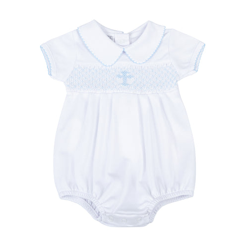 Give your little one a stylish and meaningful look with our Infant Boys Blessed Bubble from Magnolia baby. This adorable bubble features a classic peter pan collar, blue smocking, and a cross detail to symbolize blessings. Dress them in comfort and style for any occasion.