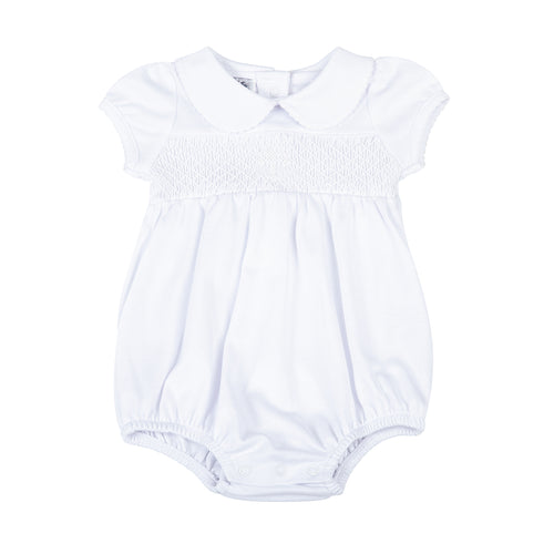 Give your little one a stylish and meaningful look with our Infant Blessed Bubble from Magnolia baby. This adorable bubble features a classic peter pan collar, white smocking, and a cross detail to symbolize blessings. Dress them in comfort and style for any Baptism or religious occasion.