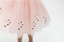 Load image into Gallery viewer, Dress your little one in the Candy Cane Twirl Tutu from Angel Dear for a whimsical and fun look. The pink tutu features sequin candy canes, and pairs perfectly with the Nutcracker Sweatshirt for a playful outfit. Perfect for any holiday celebration or everyday playtime.
