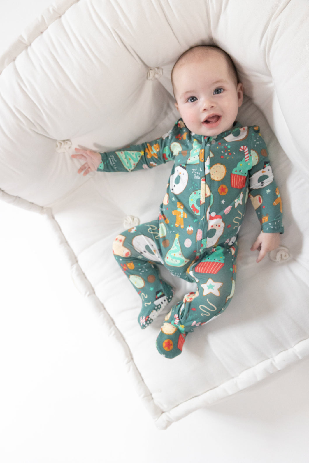 Get cozy this holiday season with our Christmas Treats 2 Way Zipper Footie Pajama from Angel Dear. Made from soft, high-quality bamboo materials, these pajamas feature festive prints of your favorite treats. Perfect for snuggling up by the fire and creating special memories with loved ones.