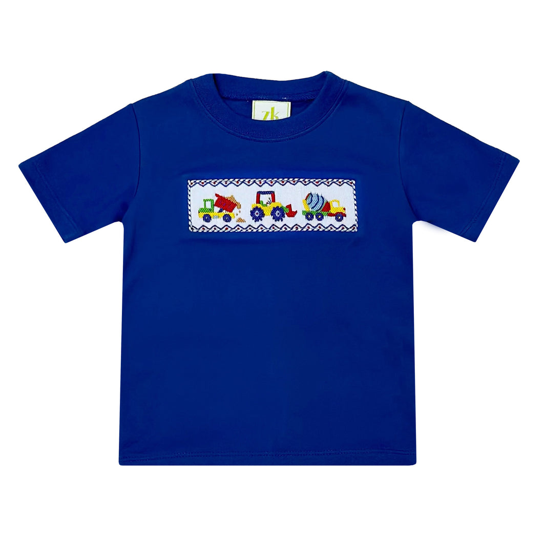 The Construction Smocked Play Tee is perfect for little ones who love to play with construction vehicles. This royal blue tee features a detailed smocked design of a construction vehicle on the front, making it both fun and stylish. Pair it with our Blue Striped Seersucker Leo Shorts for a complete look for toddler boys.