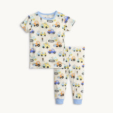 Load image into Gallery viewer, Experience the ultimate comfort with our Hare Delivery 2 Piece Short Sleeve Pajamas from Magnetic Me featuring bunnies delivering Easter eggs! With a soft and breathable fabric, these pajamas will keep your guy cozy all season long.
