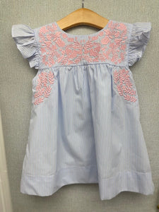 Transform your toddler girl into a cute fashionista with the Emilia Dress from Shop Teeta. Featuring blue and white vertical stripes, this dress also has beautiful, embroidered detailing and flutter sleeves. Comfortable and stylish, it's perfect for any occasion. Little Sister bubble match is also available!