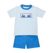 Load image into Gallery viewer, Introducing our adorable Labrador Blue Striped Tee from Zuccini Kids! Perfect for toddler boys, this tee features a classic blue stripe design and a playful smocked labrador dog riding in a truck. Pair it with our Leo Periwinkle Shorts for an effortlessly stylish look.
