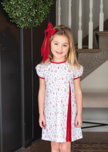 The Rosie Nutcracker Dress from James & Lottie is the perfect holiday outfit for your little dancer or Nutcracker enthusiast. Made with soft material, it combines comfort and style with a charming Nutcracker print. Dress her up for this festive season with this adorable dress.