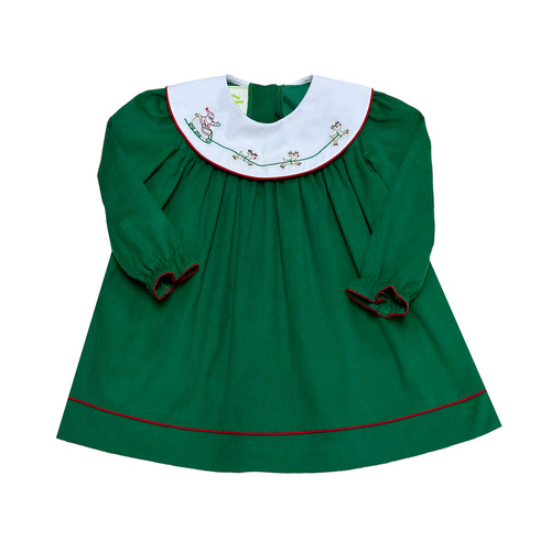 Get your little girl ready for the holiday season with Santa's Sleigh Corduroy Dress from Zuccini Kids. This dress features a festive green corduroy with a white collar adorned with an embroidered Santa's sleigh. Perfect for any holiday event, this dress is both stylish and comfortable.