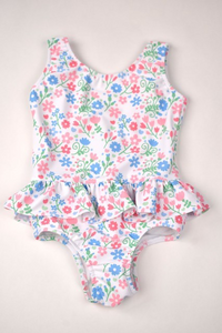 Get ready to make a splash with our Floral Ruffle One Piece Swimsuit! Designed by Funtasia Too, this adorable swimsuit features a cute pink, blue and green floral design on a white background and ruffle waist accent.