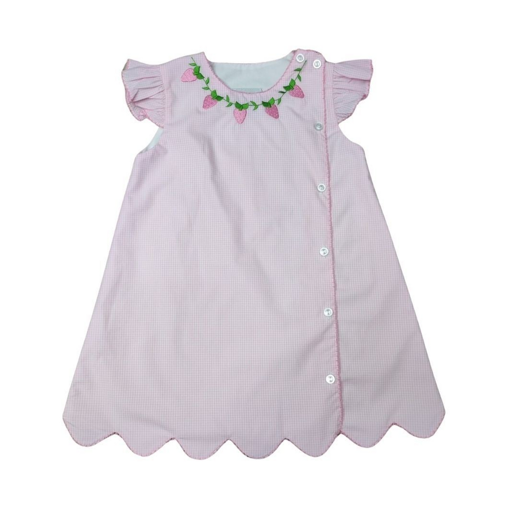 Get ready for spring with our Pink Strawberry Side Button Dress! Made for toddler girls, this dress from Delaney features adorable embroidered strawberries along the neckline. The soft pink and white gingham check adds a classic touch, while the side buttons and scallop hemline add a cute detail. Perfect for any spring occasion, this dress is both fun and beautiful.