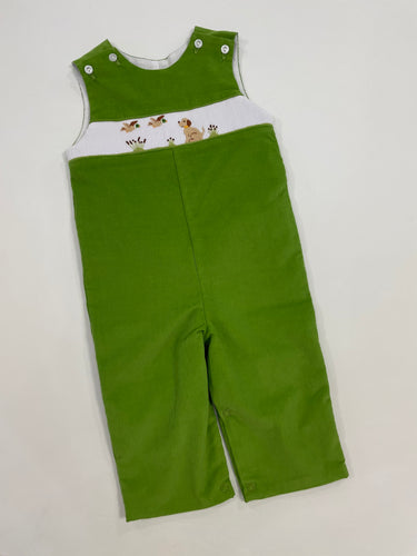 This classic corduroy infant boy jon jon is a must-have for any toddler boy's wardrobe. The adorable flying ducks and dog smocked detail along the front adds a charming touch to any occasion. Made with high-quality material, this jon jon is both comfortable and stylish. A perfect addition to your little one's outfits. Matching sibling sets available