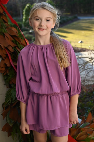 Introducing the Rory Dress in Magenta from pleat.... The perfect dress for all your fall occasions. With its vibrant color, cinched waist, and elegant bubble sleeves, this dress will make girls stand out in style.