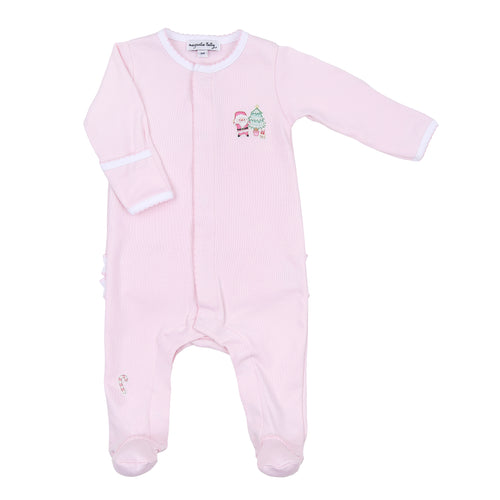 Get your little one ready for a cozy Christmas with our Sweet Little Christmas Pajamas! Featuring a festive Santa embellishment and adorable ruffle back, these pink footie pajamas from Magnolia Baby will keep your baby warm and stylish all night long. Perfect for a night of snuggles and holiday magic.